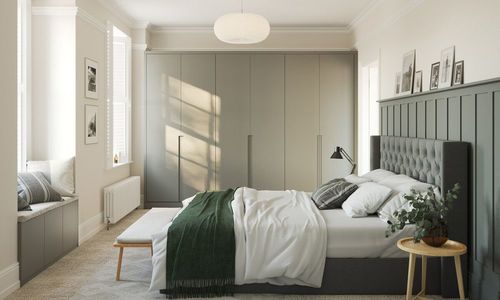 green and grey bedroom with fitted wardrobes