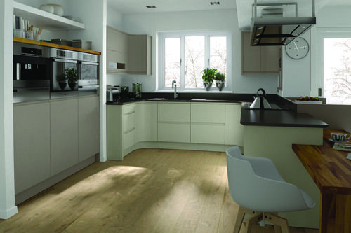 A kitchen with a wood floor and built-in NEFF appliances