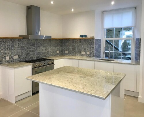 Built-in white wardrobe and storage solutions in modern bedroom