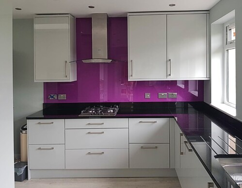 Built-in white wardrobe and storage solutions in modern bedroom