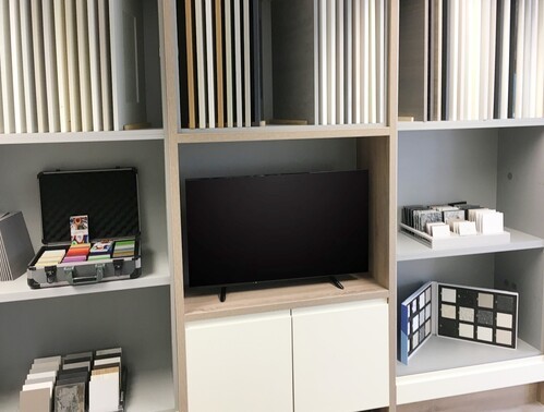 Showroom shelving unit with sample worktops, doors, and design materials