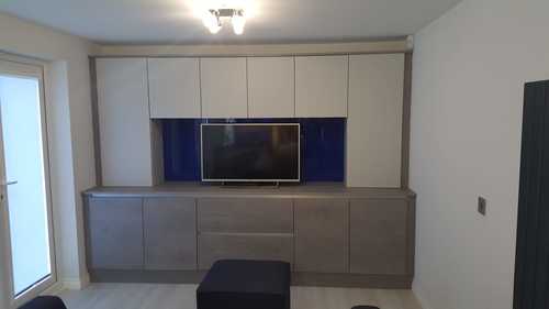 modern concrete kitchen design that extends into the living room