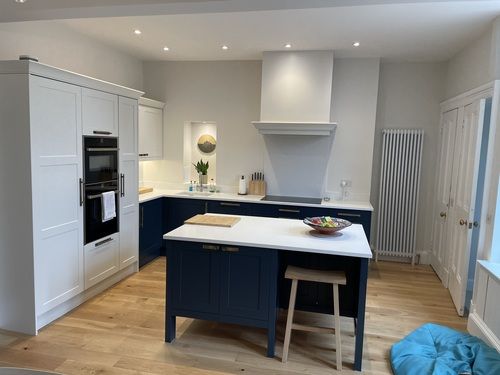 navy blue and light grey shaker kithen