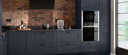 blue shaker kitchen with black handles