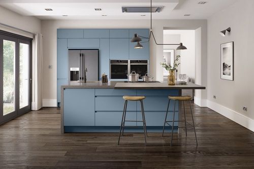 A contemporary blue kitchen with island and breakfast bar.