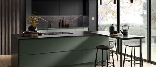 green and grey kitchen with marble splashback