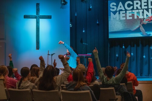 Kid preforming skit with blow up chicken