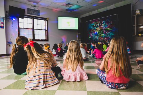 Preschoolers watching a video at GoKids 