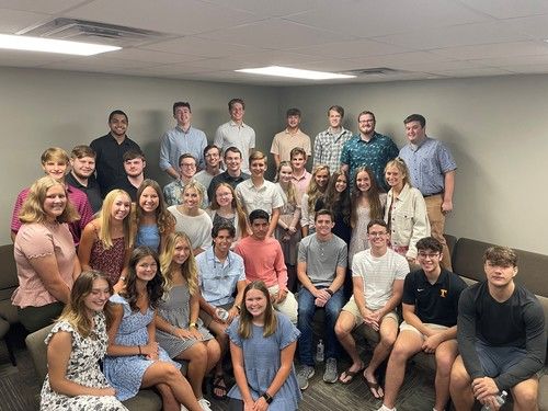 Young adults group on a beach retreat