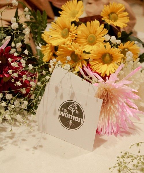 Flowers around the FBC Women's logo