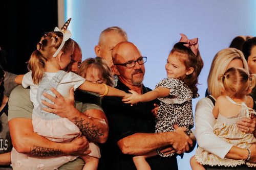children hugging their parents