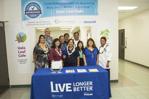 group of men and women receiving an award