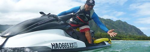 man on jet ski performing rescue