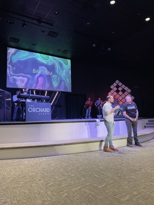 Pastor Alex welcoming new church member