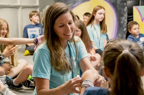 Kids Volunteer sharing hands on lesson with kids