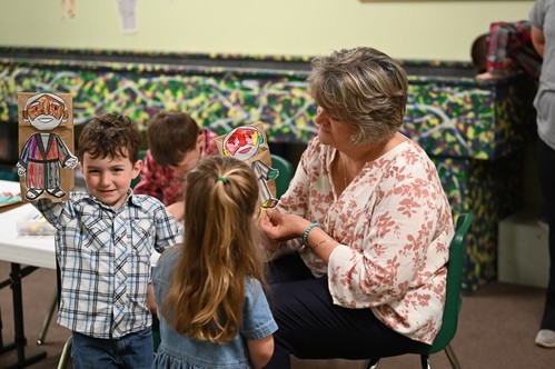 Women teaching Children