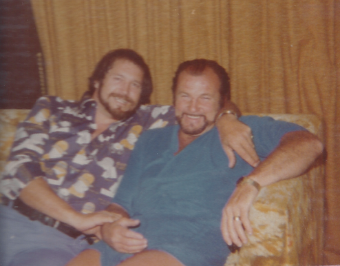 Luke and Dutch smiling on a couch