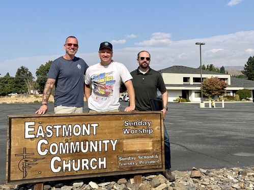 Three men in front of Eastmont Community Church
