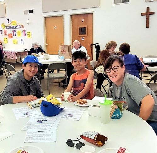 A family enjoying dinner at a round table