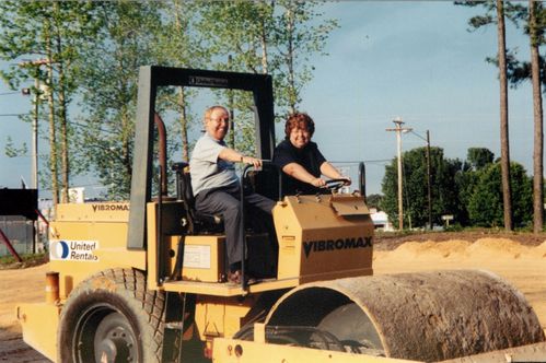 Photo of Pastor Tom and Marsha Roberts on the construction site of the new building.