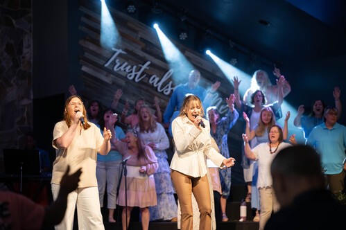 Liberty Church's worship team on stage playing instruments and singing a worship song.