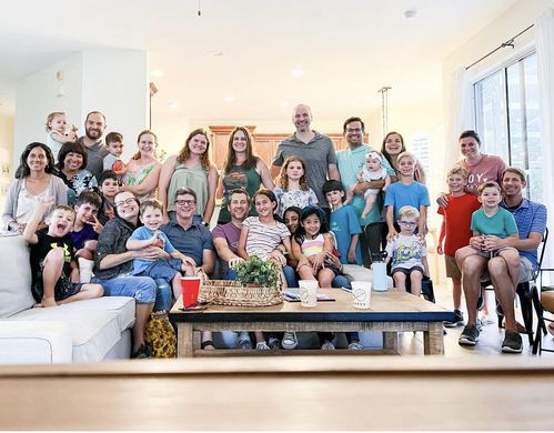 community group taking photo in a home