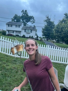 Young adult woman roasting marshmallows
