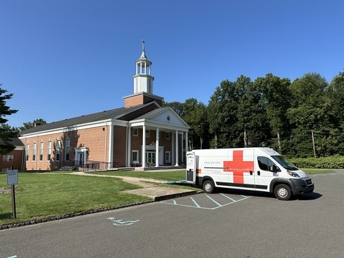 Front of Long Hill Chapel with American Red Cross van with red cross on it