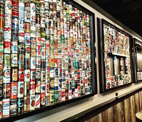 Image of David Sloan's legendary beer collection on display at Mary Ellen's
