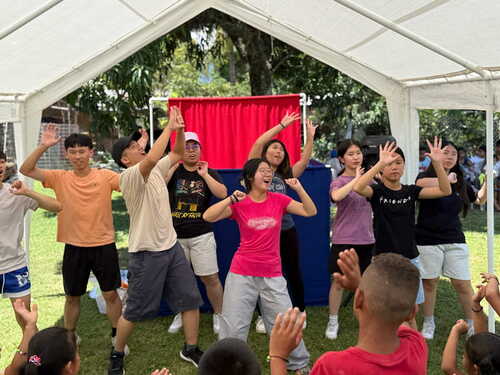 Anita leading worship during a VBS