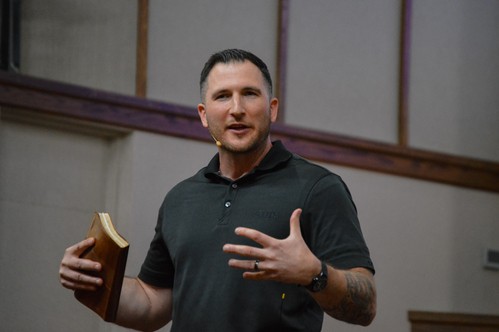 NABC's senior pastor preaching on a Sunday morning with a Bible in hand