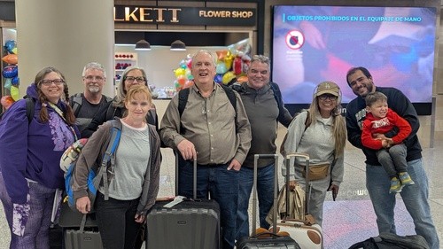 people with luggage at the airport after arriving in Equador