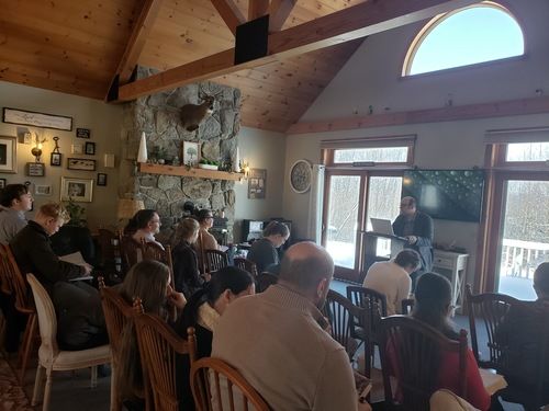 Group of people meeting in a home.