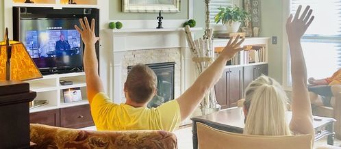 Man with hands raised in worship