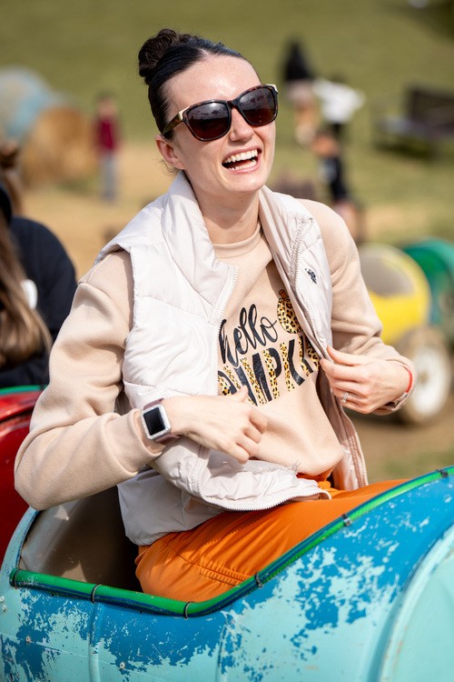 two older ladies are smiling and greeting each other
