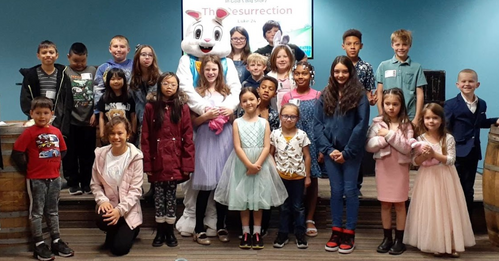 A group of children standing for a photo at One Hope Kids, a ministry of One Hope Church.