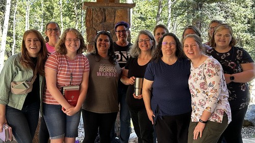 A group of women of diverse ages posing for a picture