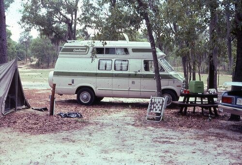 Old can next to a tent.