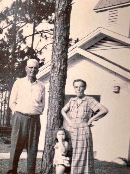 Gamble, Lethie, and Donna Lin Williams (1961) in front of the Community Church he helped to build