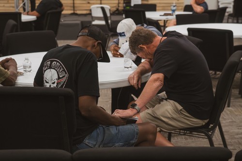 Men engaging in group prayer as a part of the Radical men's ministry at Calvary Worship Center in Colorado Spring CO.