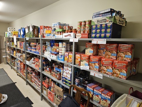 Shelves of food for the MedinaUMC Food Pantry including Hamburger Helper, Chunky soup, and other Campbell's soups