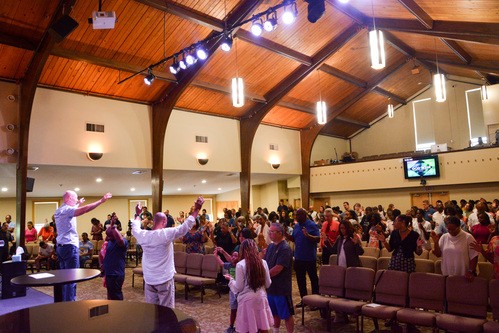 Group of people in matching Calvary shirts