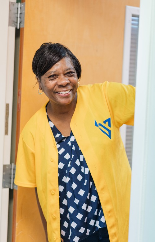 Vivid City Kids volunteer watching over children and greeting families at Greensboro NC campus