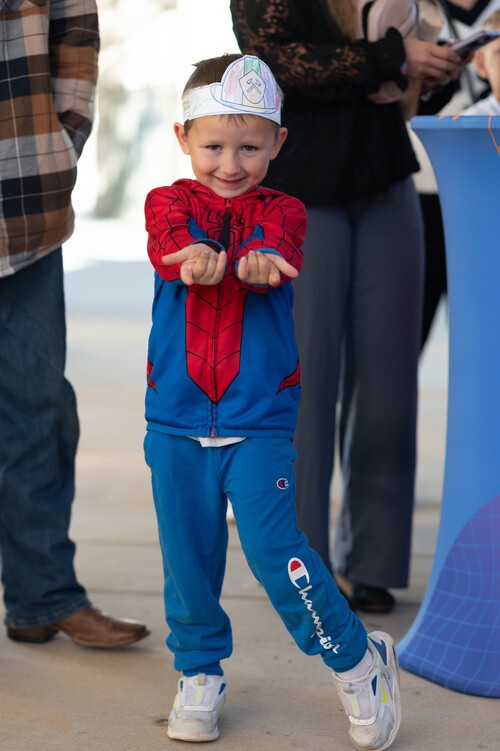 Parents checking in children at Vivid City Kids secure check-in station Greensboro NC