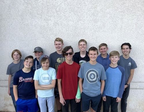  youth boy and girls smiling in a group.