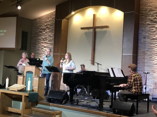 Our pastors outside the church