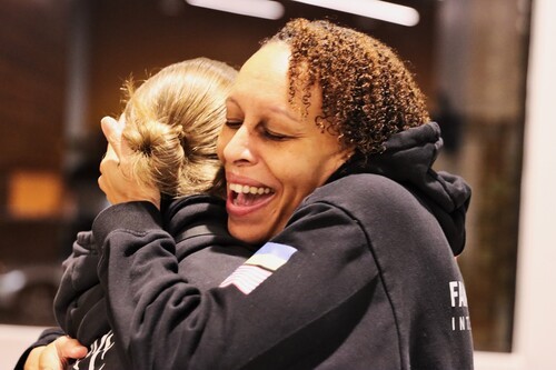 Two women giving eachother a hug for support