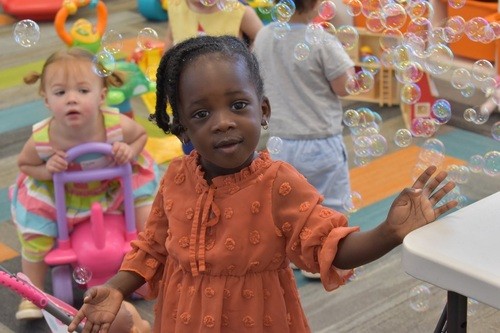 Child playing with other children at Crossroads Church