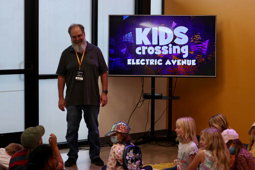 Youth pastor in Fredericksburg talking to children