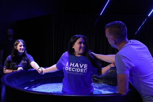 A women getting baptized at Crossroads Church